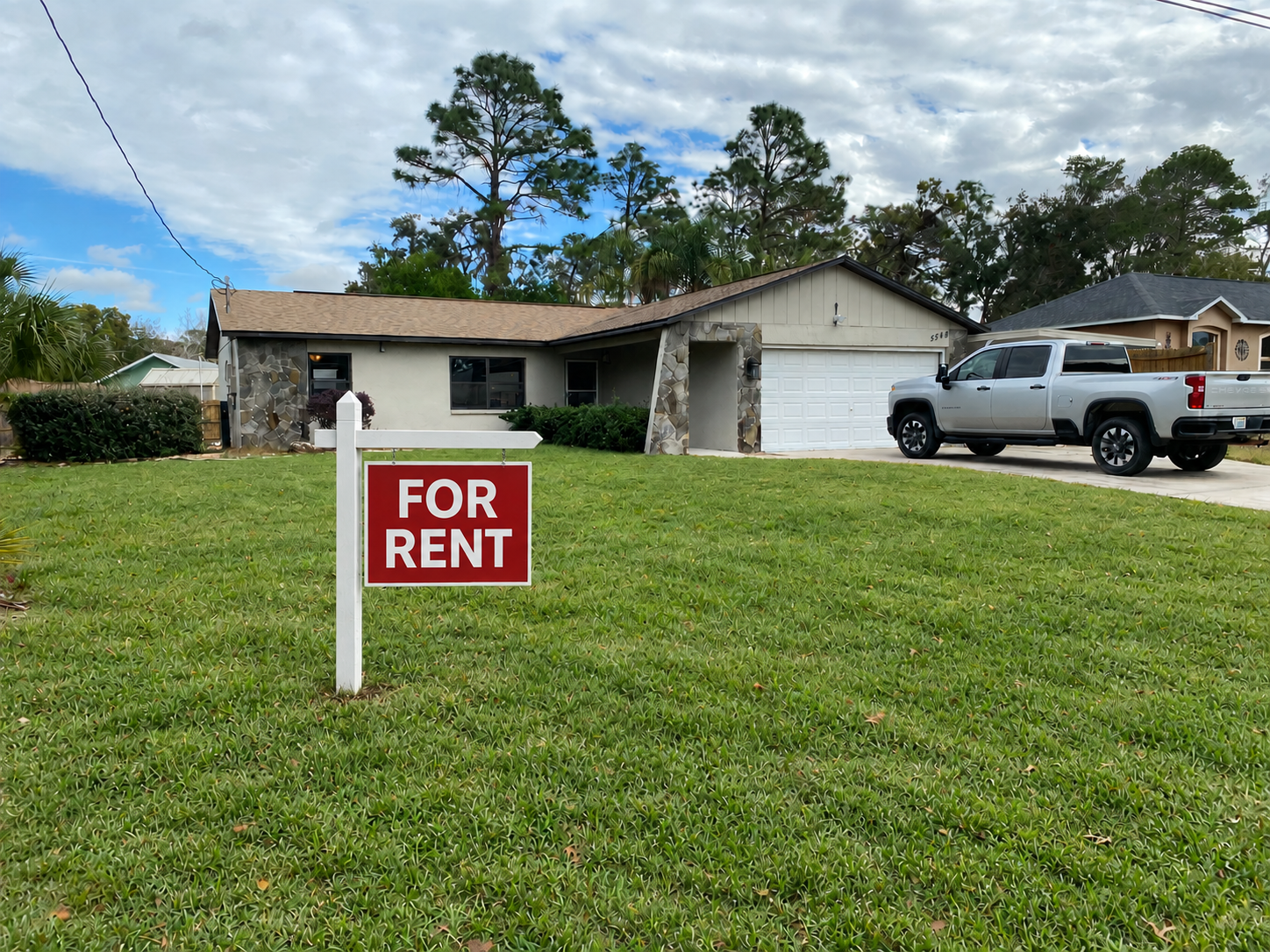 Florida home with a red For Rent sign representing new rental listings